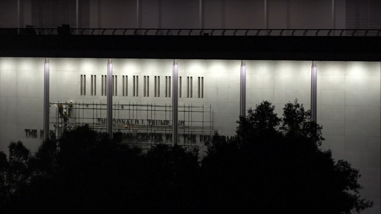 Source-feed image associated with Workers begin removing Trump's name from the Kennedy Center, hours after a court-ordered deadline
