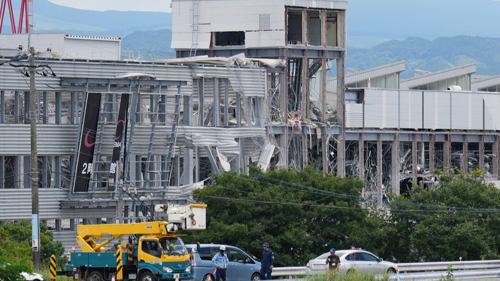 Source-feed image associated with Rescuers search for survivors after powerful quake kills at least 18 in southwestern Japan