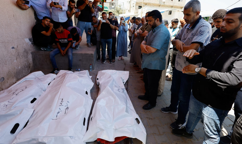 Source-feed image associated with Israeli strikes kill at least a dozen people in Gaza, including police officers