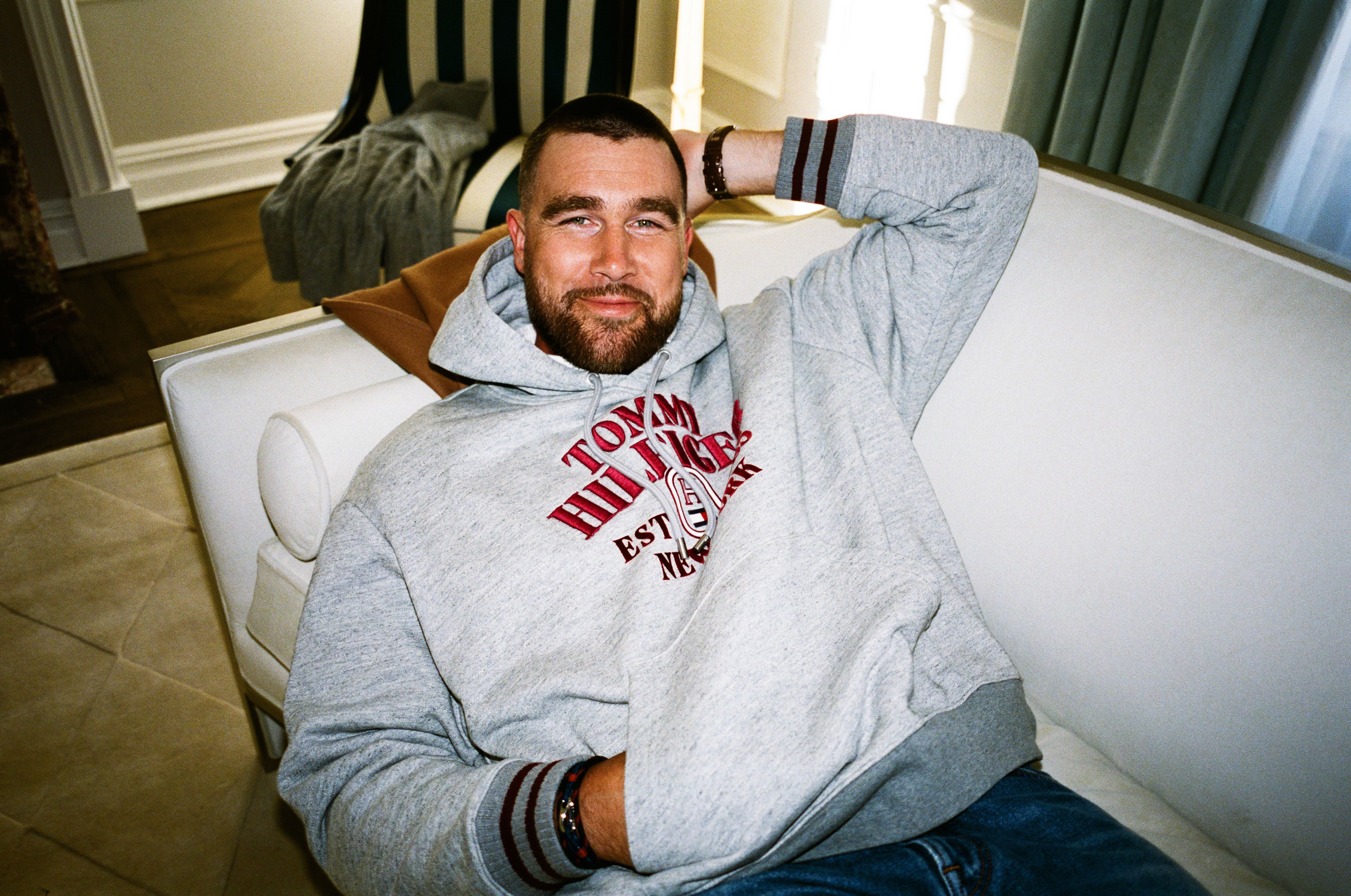 Source-feed image associated with Travis Kelce: Football Star, Fashion Ambassador, and Dog Dad