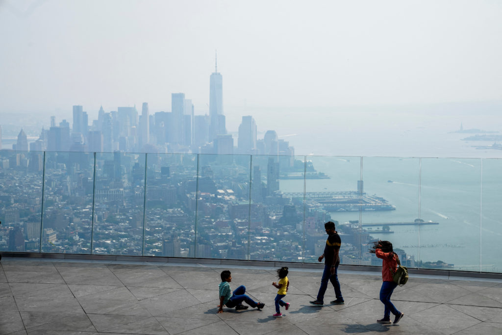 Source-feed image associated with Heavy smoke from wildfires blankets the Northeast and Mideast, prompting evacuations