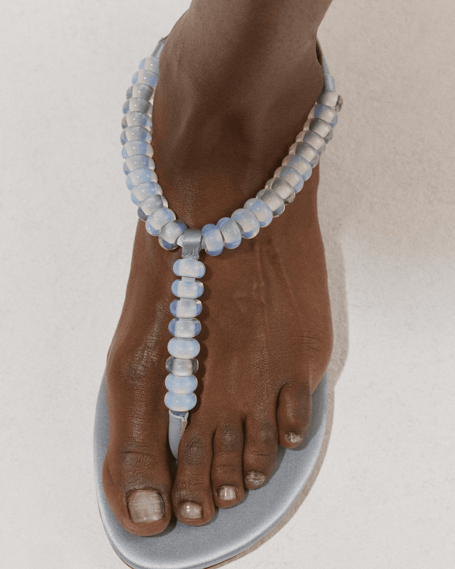 Source-feed image associated with The Embellished Sandals We’re Loving for Summer 2026—From Sequined and Beaded to Netted