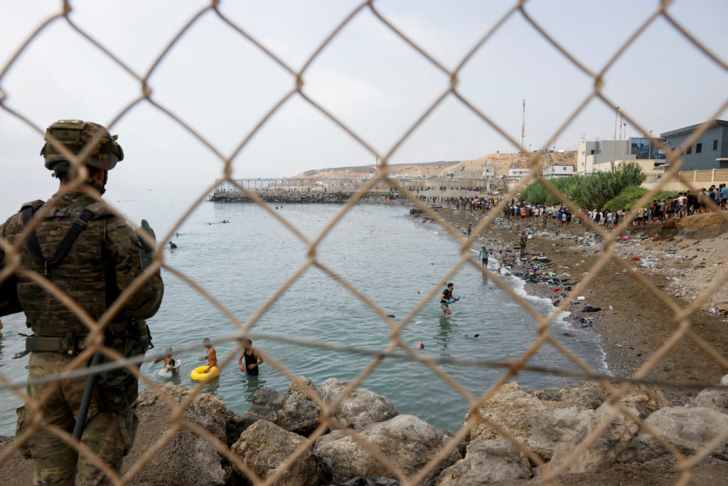 Source-feed image associated with Most of the 60,000 migrants who crossed into territory of Ceuta have left voluntarily, Spain says