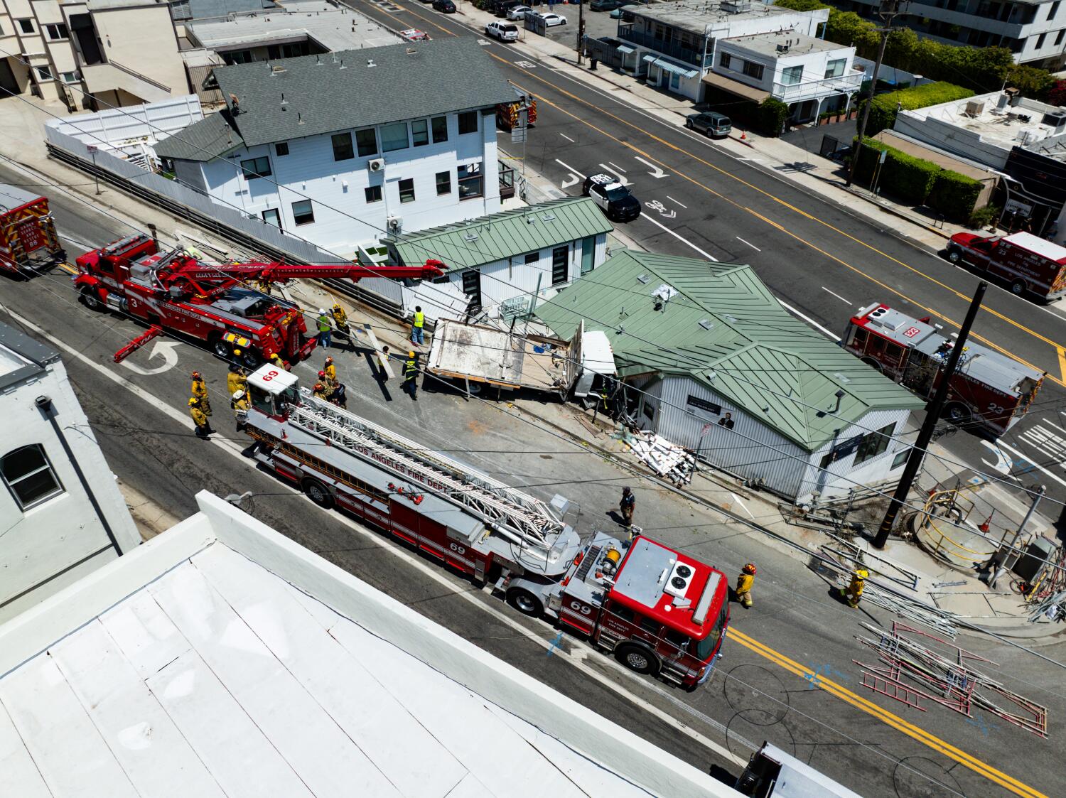 Source-feed image associated with Fire crews rescue man trapped in truck that crashed into a Pacific Palisades building