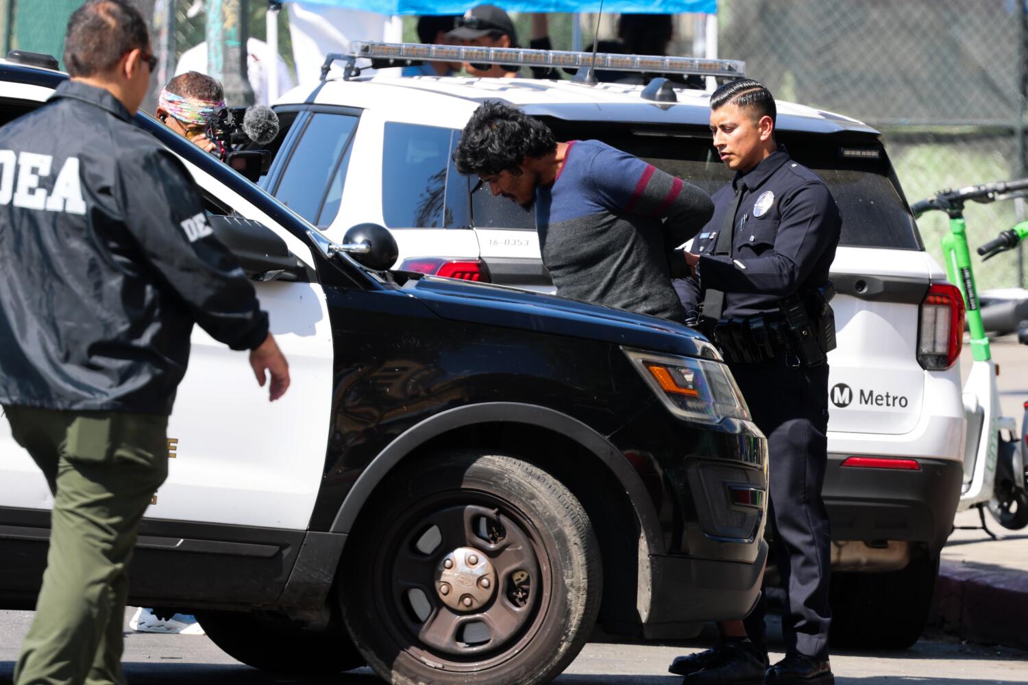 Source-feed image associated with 'We mean business.' MacArthur Park raid is latest in push to reclaim fentanyl hub, officials say