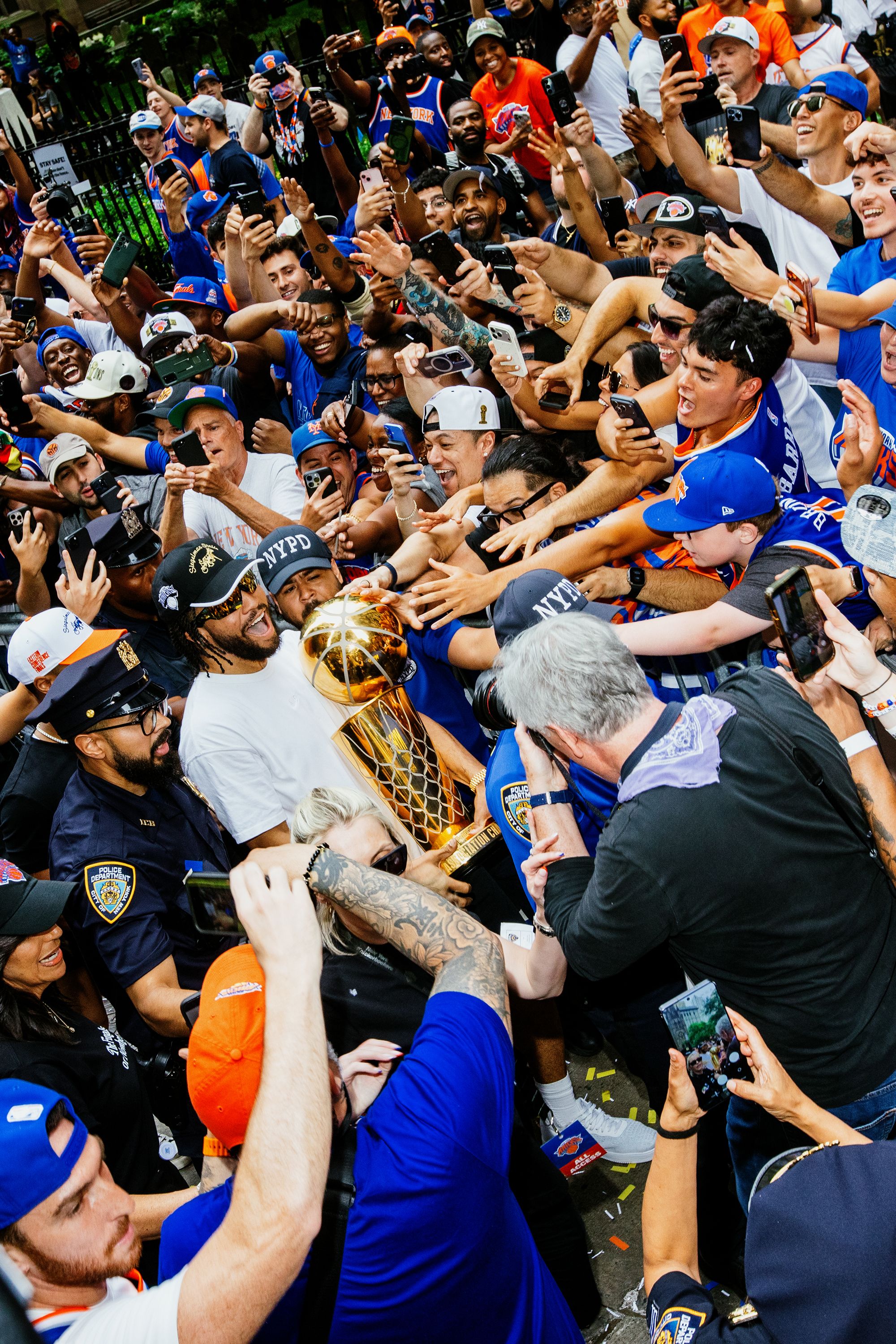 Source-feed image associated with At the Parade of Champions, Knicks Fans Color New York City Orange and Blue