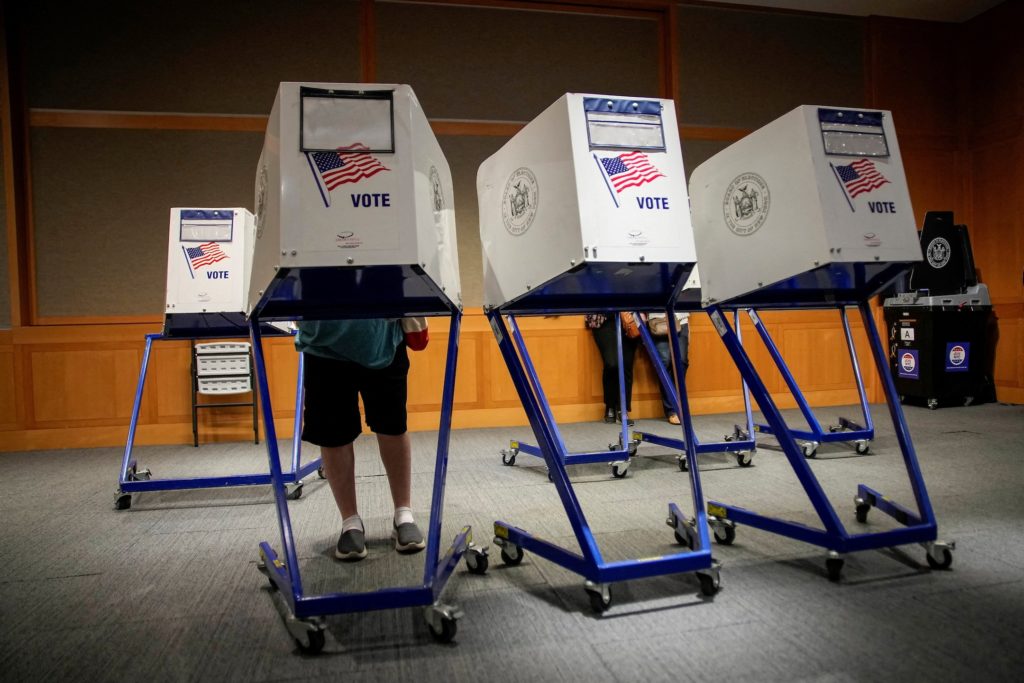 Source-feed image associated with DOJ threatens to arrest state election officials if noncitizens vote