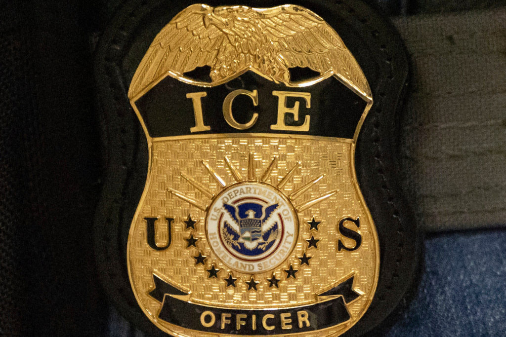 Source-feed image associated with ICE officer pleads not guilty to lying about shooting and is ordered released from custody
