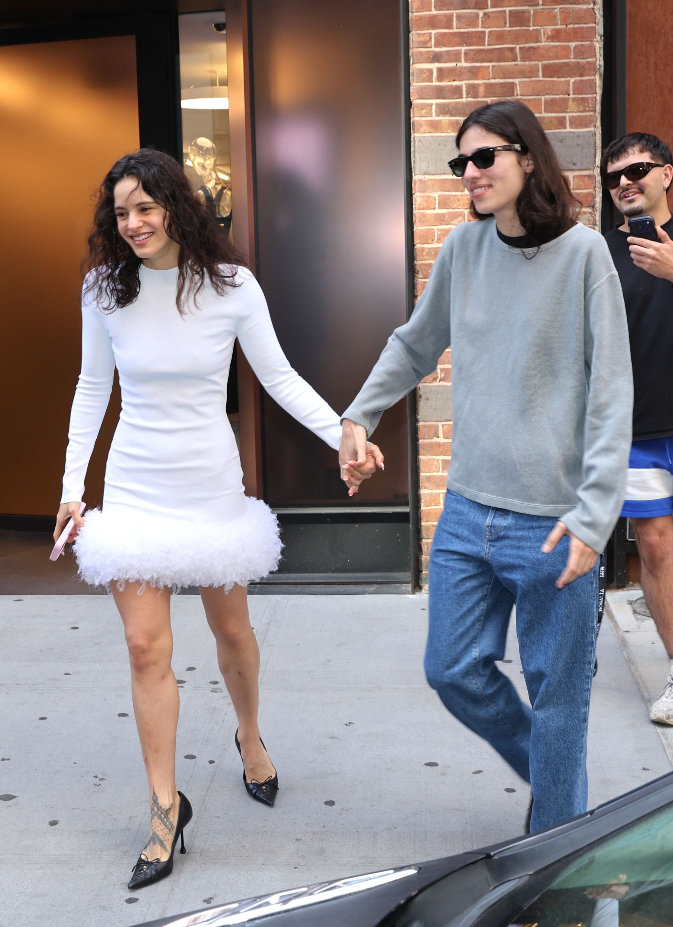 Source-feed image associated with Rosalía and Loli Bahia Make the Coolest Case for Contrasting Couple Style