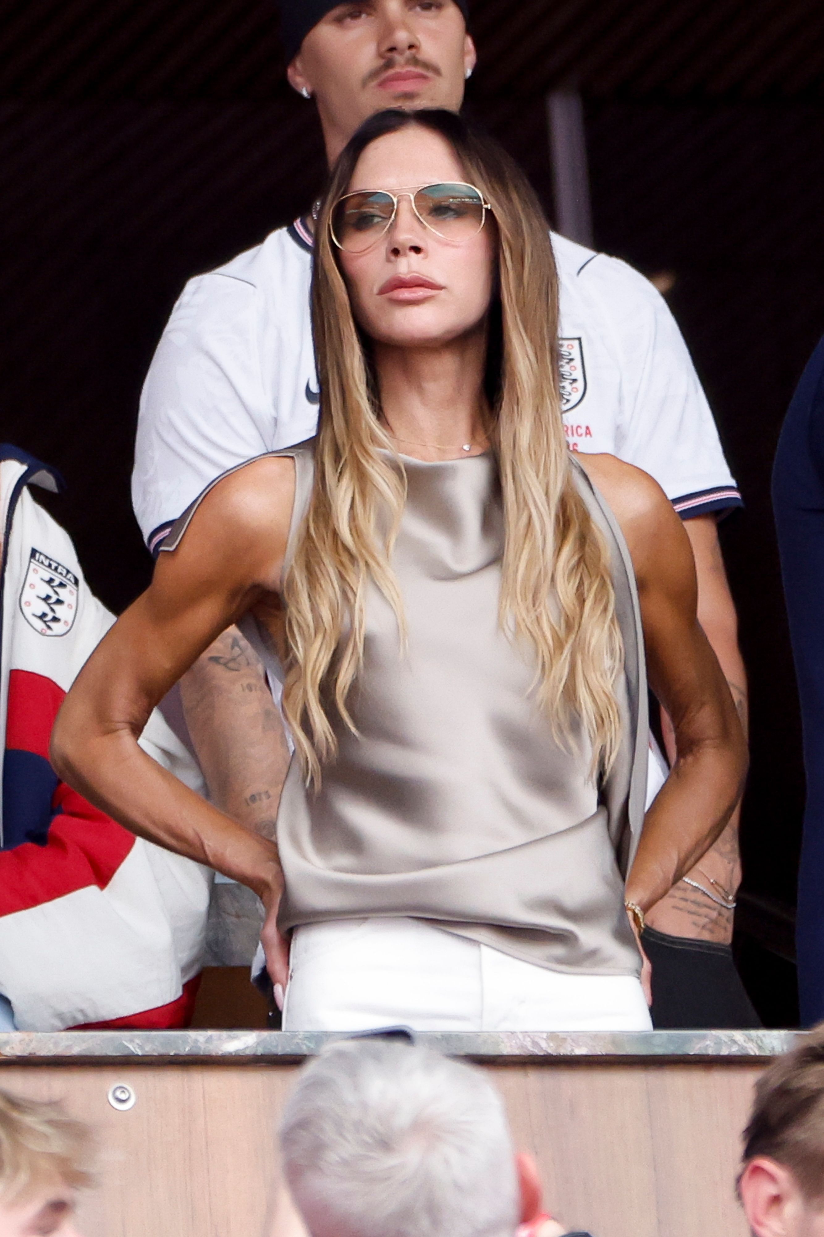Source-feed image associated with 20 Years On, Victoria Beckham Refines Her WAG Style