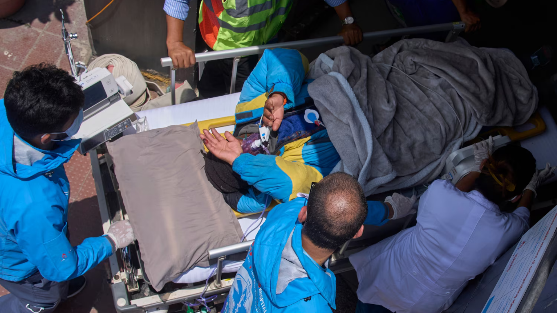 Source-feed image associated with Family questions rescue efforts for Sherpa guide found alive on Everest