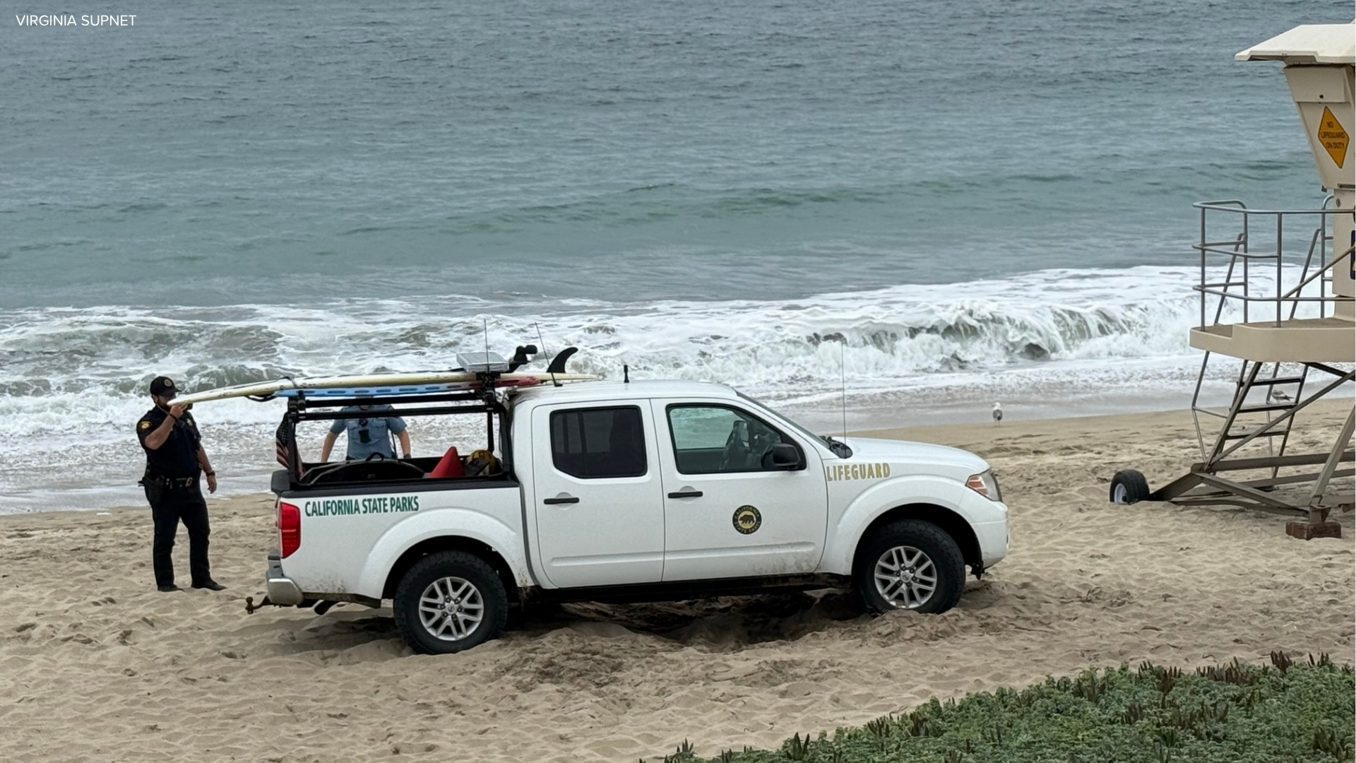 Source-feed image associated with Possibly distracted lifeguard in truck ran over woman lying on Half Moon Bay beach