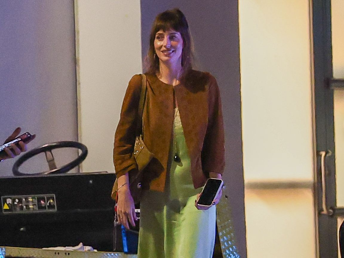 Source-feed image associated with Dakota Johnson Embraces the Color of the Moment—and a Surprising Jewelry Choice