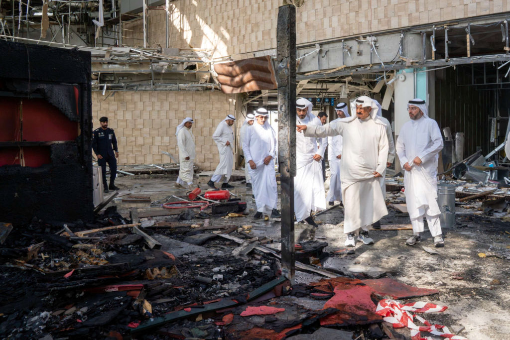 Source-feed image associated with Iranian strikes set Kuwait's largest airport ablaze amid fragile ceasefire with the U.S.