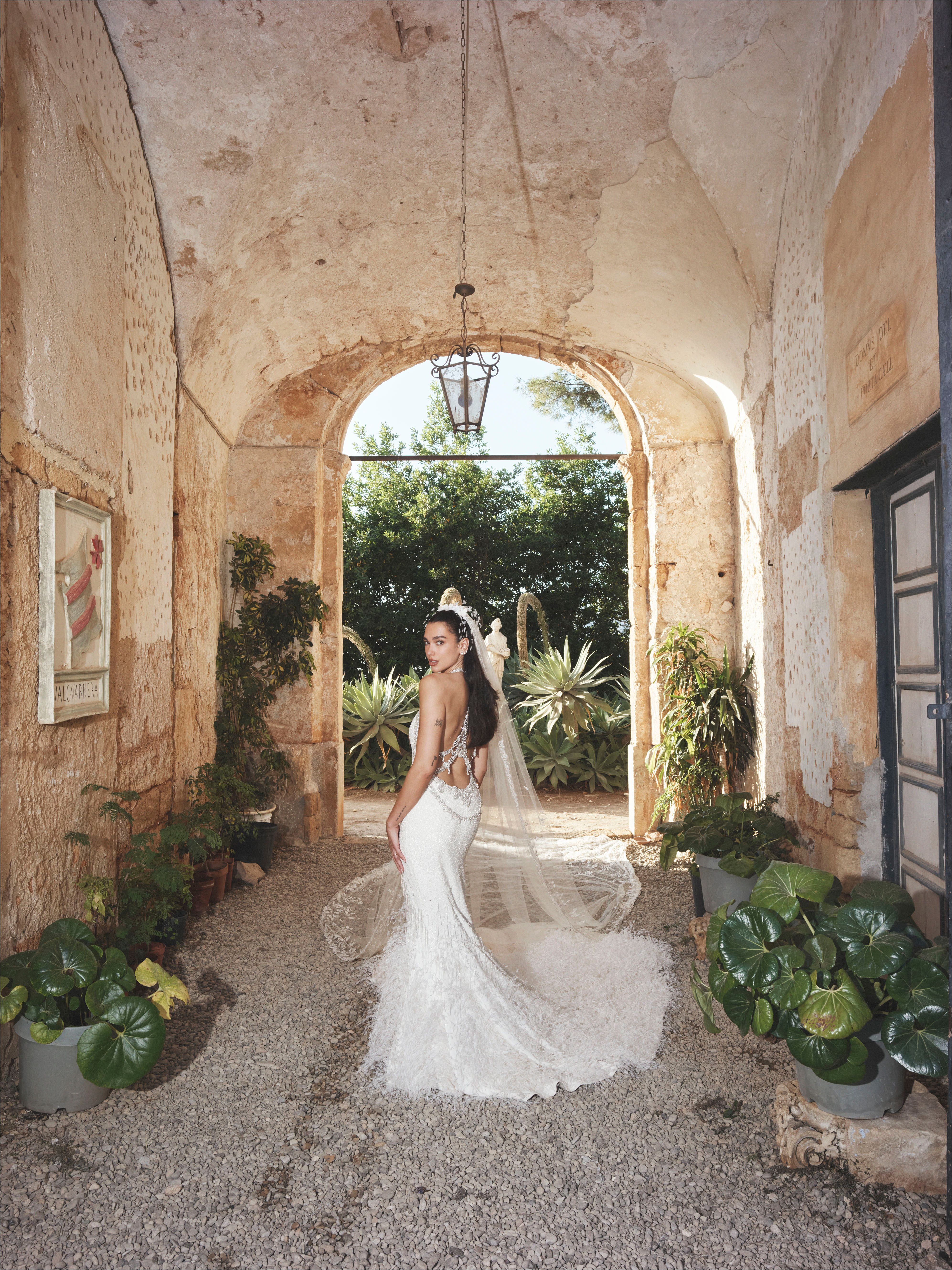 Source-feed image associated with Versace! Chanel! Bottega! Schiaparelli! See Dua Lipa’s Wedding Looks All in One Place