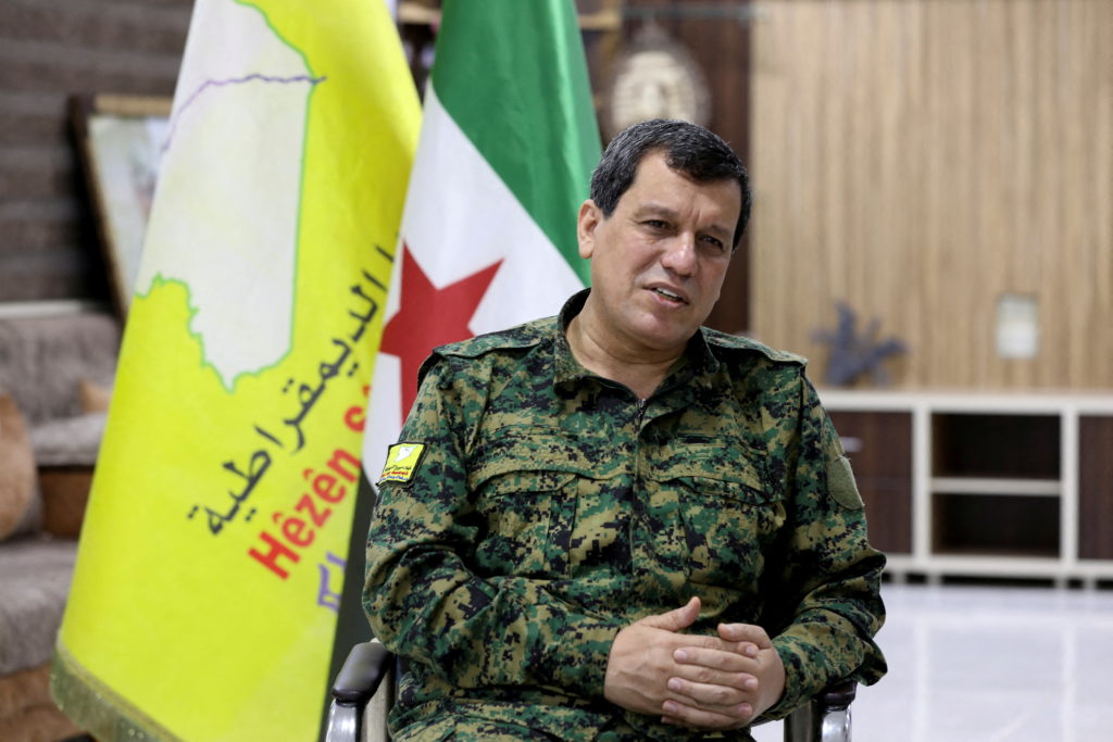 Source-feed image associated with Kurdish-led group in Syria says it has dissolved after merging with the army