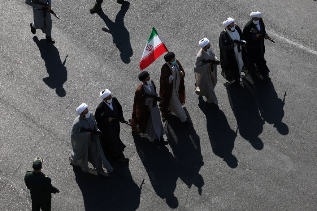 Source-feed image associated with Iranians rally by the hundreds of thousands in biggest show of defiance since war began