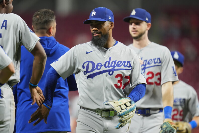Source-feed image associated with A quiet toast as the Dodgers clinch record-tying 14th straight playoff spot