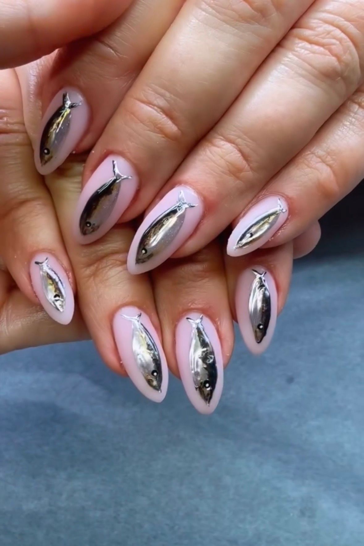 Source-feed image associated with The Sardine Manicure is Summer 2026's Unexpected Nail Art Trend
