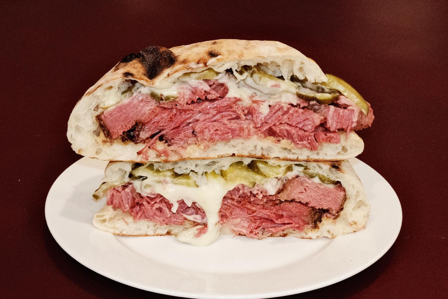 Source-feed image associated with 'It looks like a war.' How a $38 Armenian brisket sandwich ignited debate over culture and cost