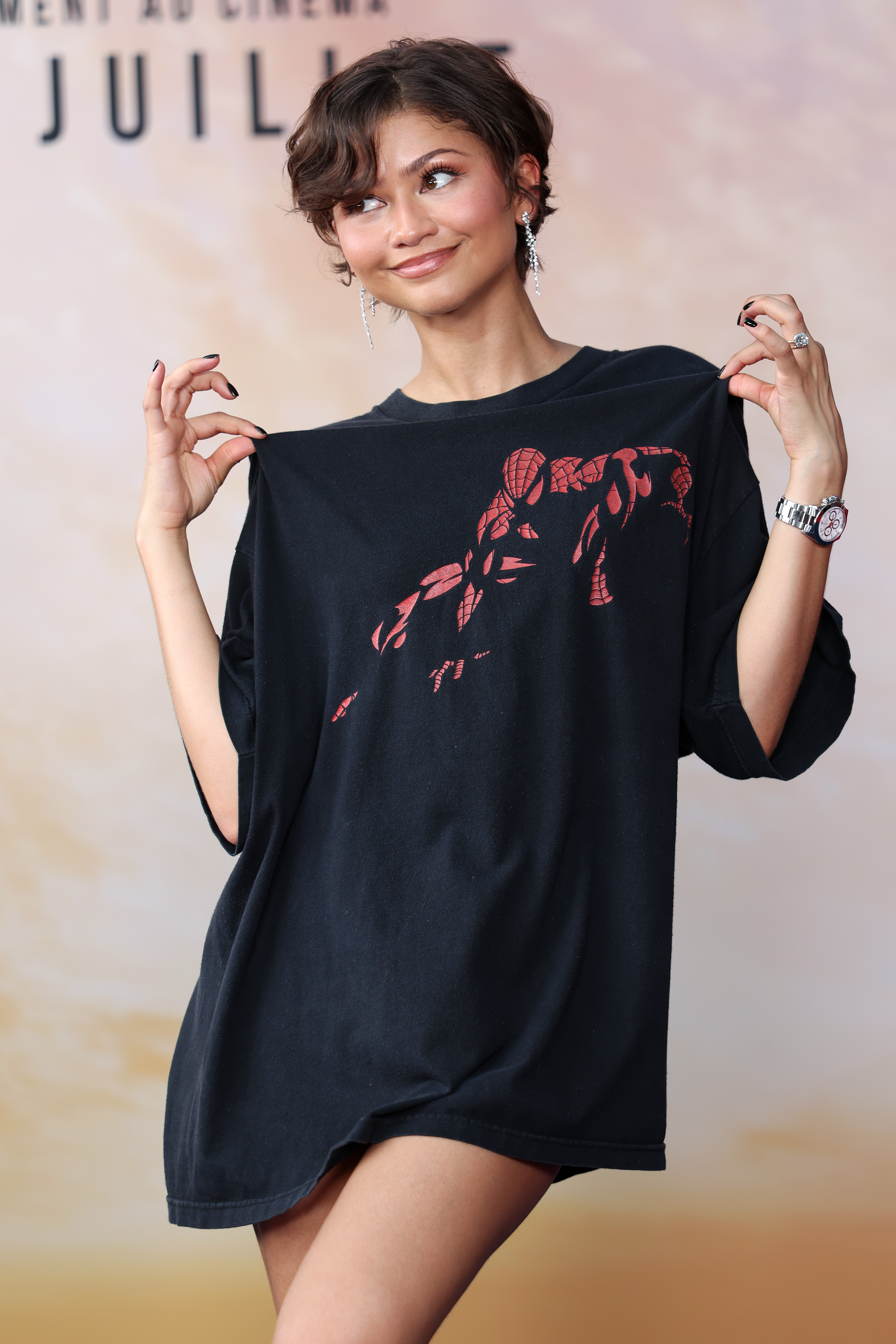 Source-feed image associated with Zendaya Wears $35 Spider-Man T-Shirt to ‘Brand New Day’ Fan Event in Paris: ‘Style Doesn’t Always Have to Cost a Fortune’