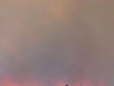 Source-feed image associated with Fast-moving wildfire amid shifting winds threatens Reno, Nevada, forcing thousands to evacuate