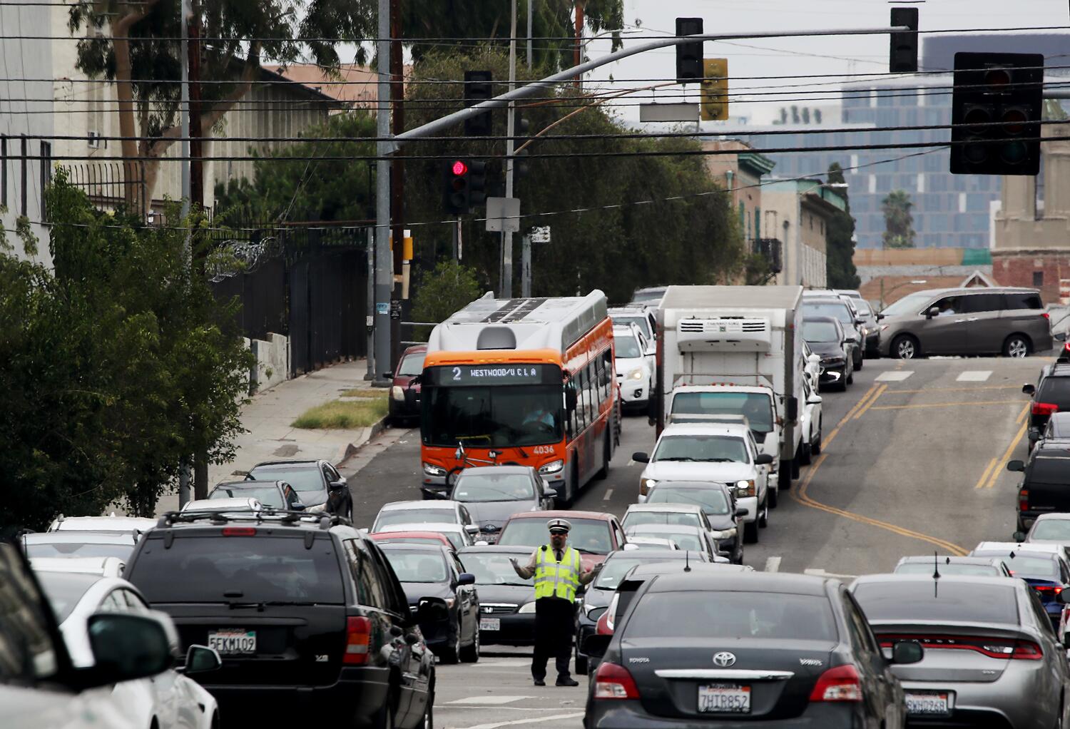 Source-feed image associated with L.A. says bike lanes on Pico Boulevard would boost safety. Merchants fear fallout