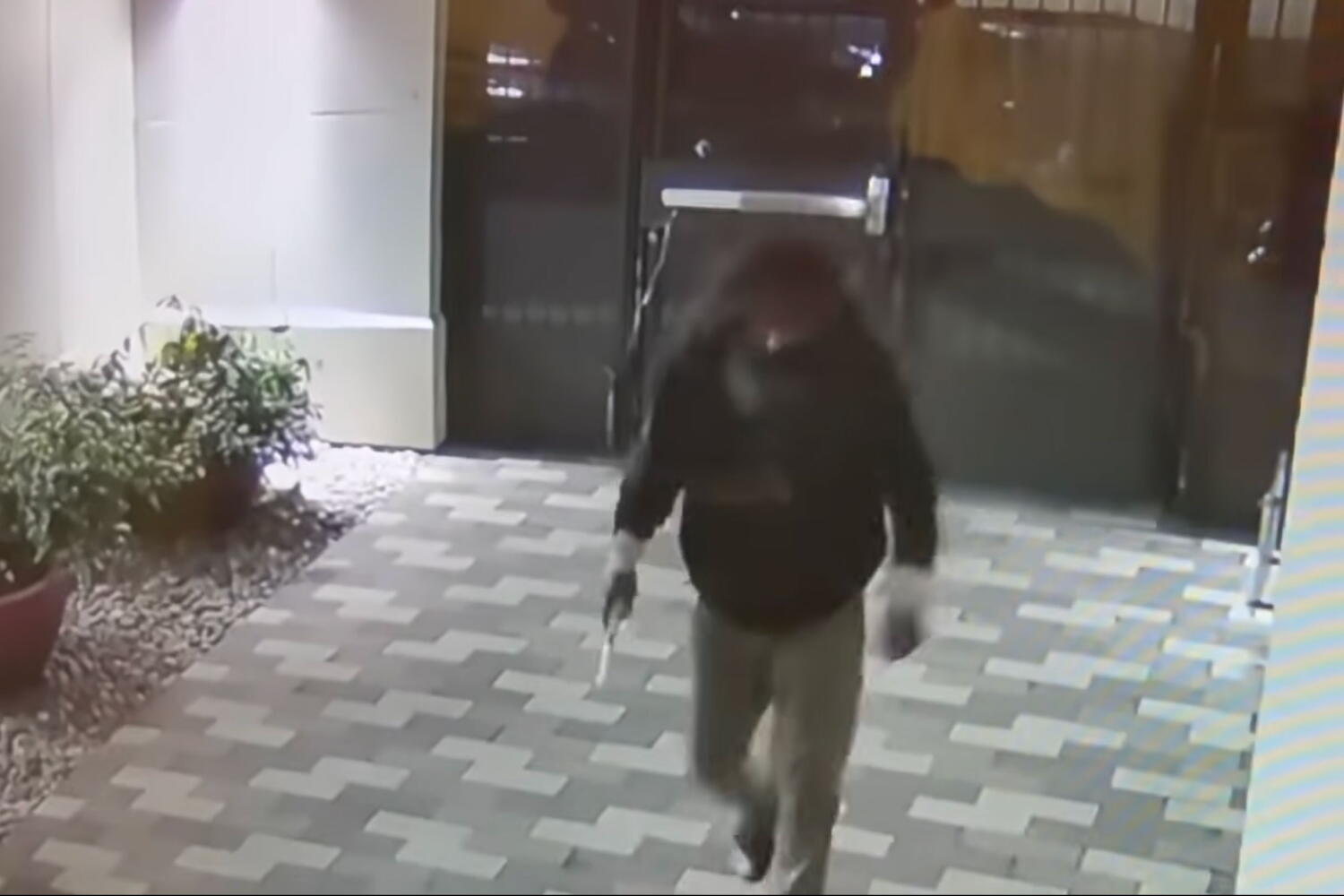 Image from linked report: 'Like a horror movie.' Man following UC Berkeley student scales apartment complex gate
