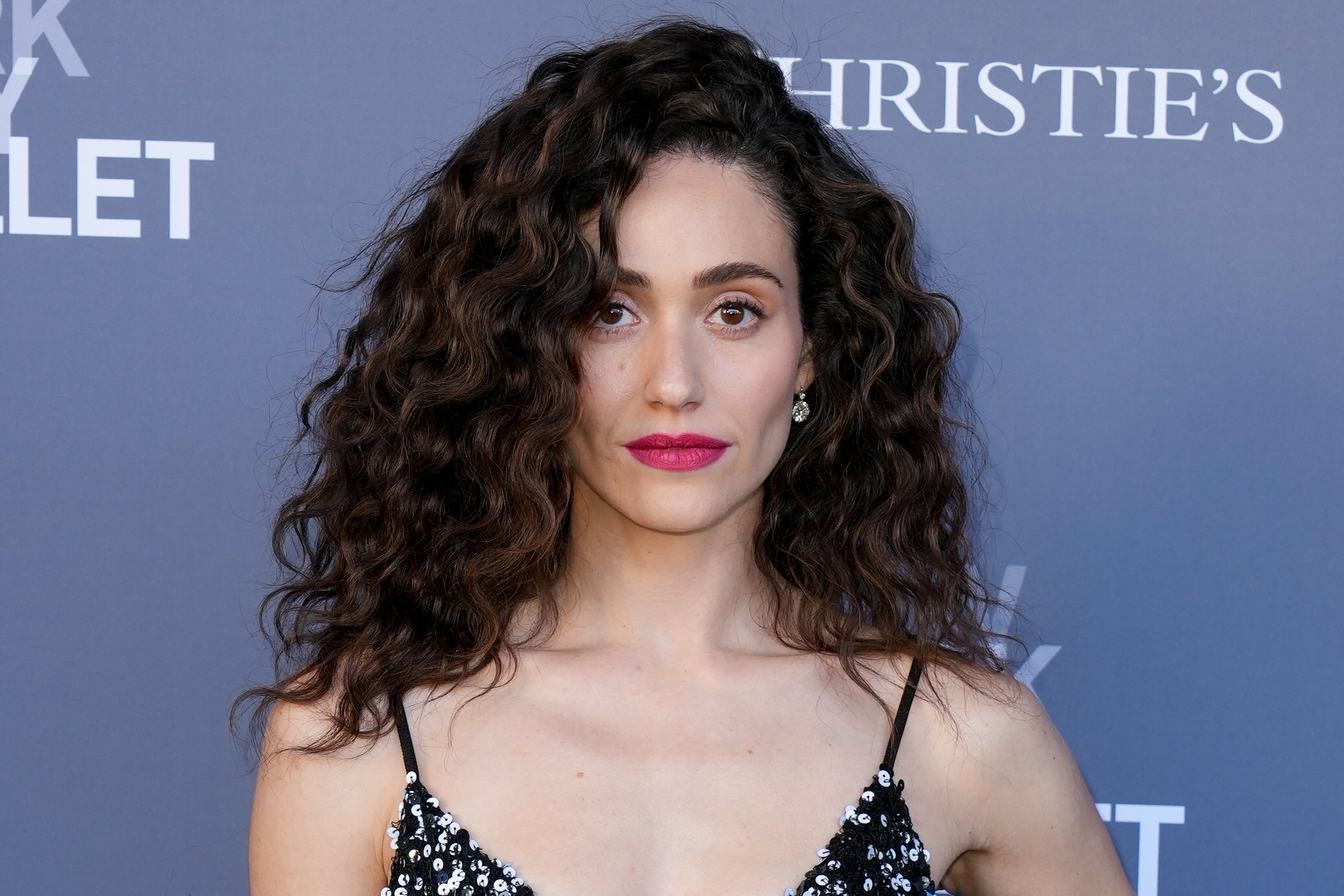 Source-feed image associated with Emmy Rossum on ‘Furious’ Serial Killer Targeting Jeffrey Epstein-Like Predators: ‘You Don’t Want to Root for Her, And Yet Maybe She’s Got a Point’