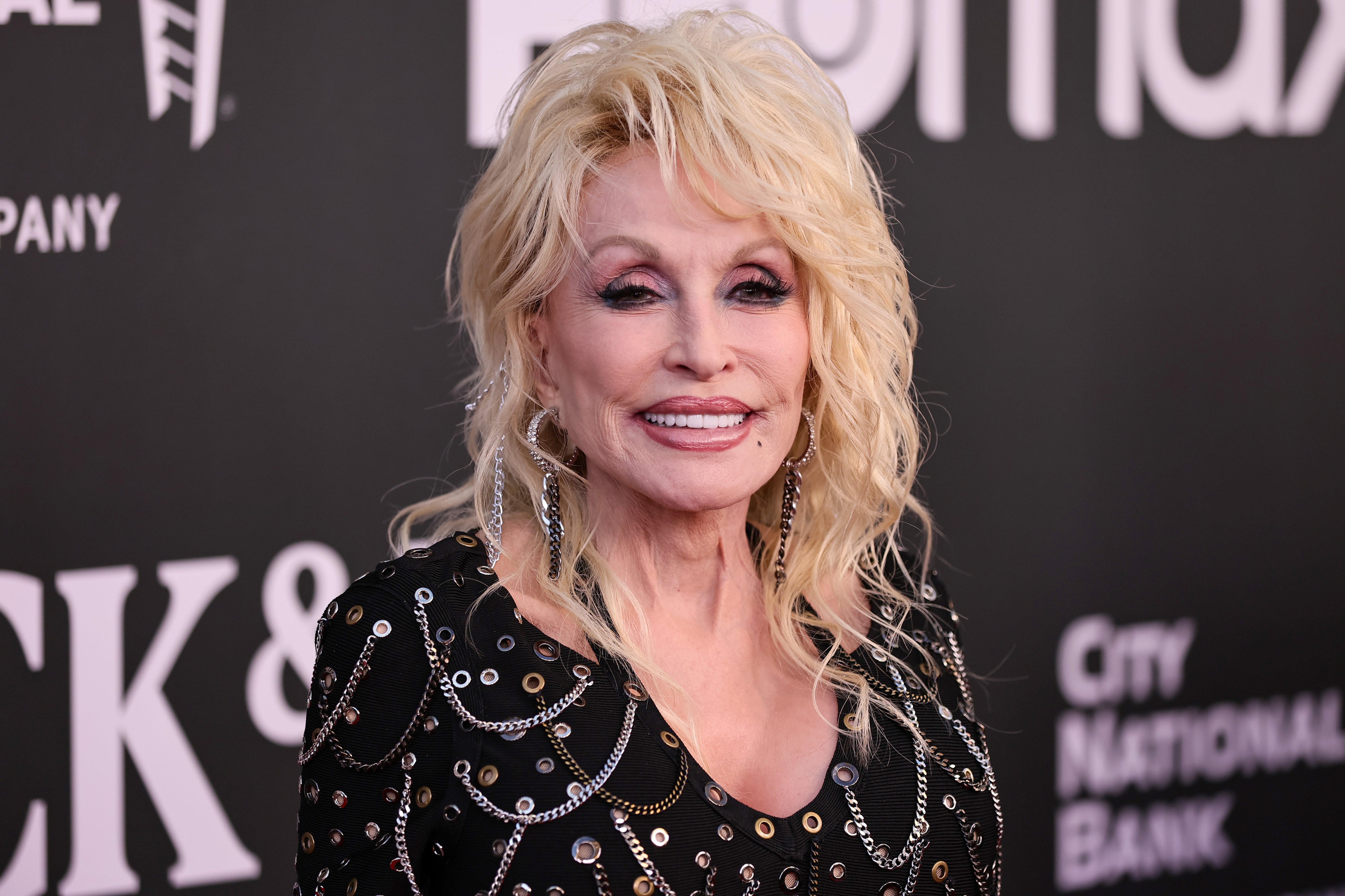 Source-feed image associated with Dolly Parton Died After a ‘Brief Battle’ With Cancer, According to Her Reps