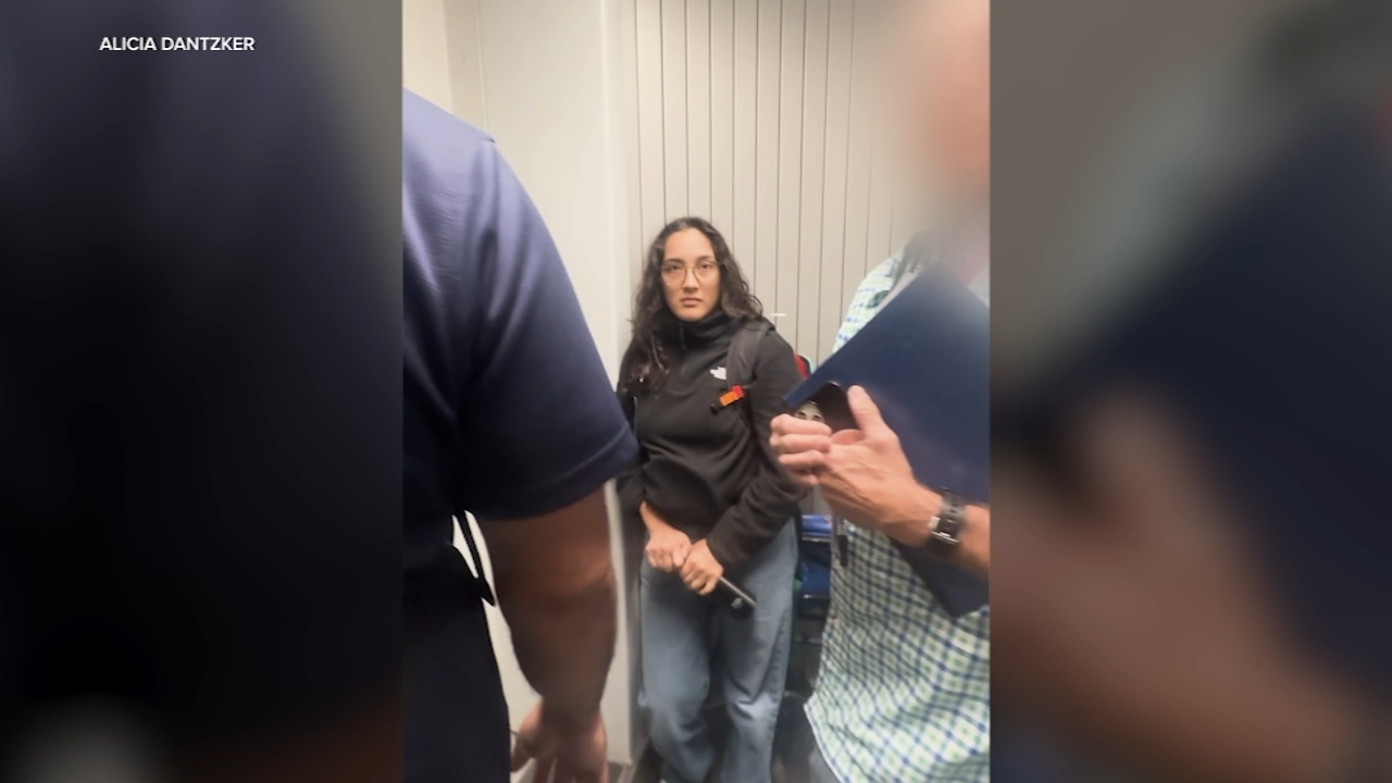 Source-feed image associated with Video shows ICE arresting Oakland woman at Denver airport