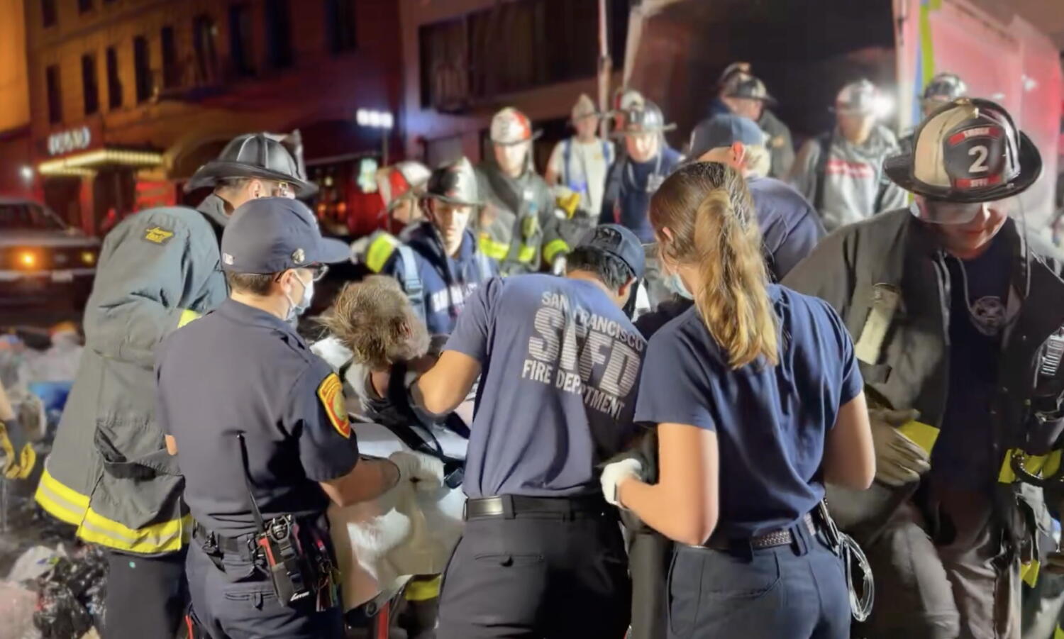 Source-feed image associated with Firefighters rescue man trapped for hours inside San Francisco garbage truck