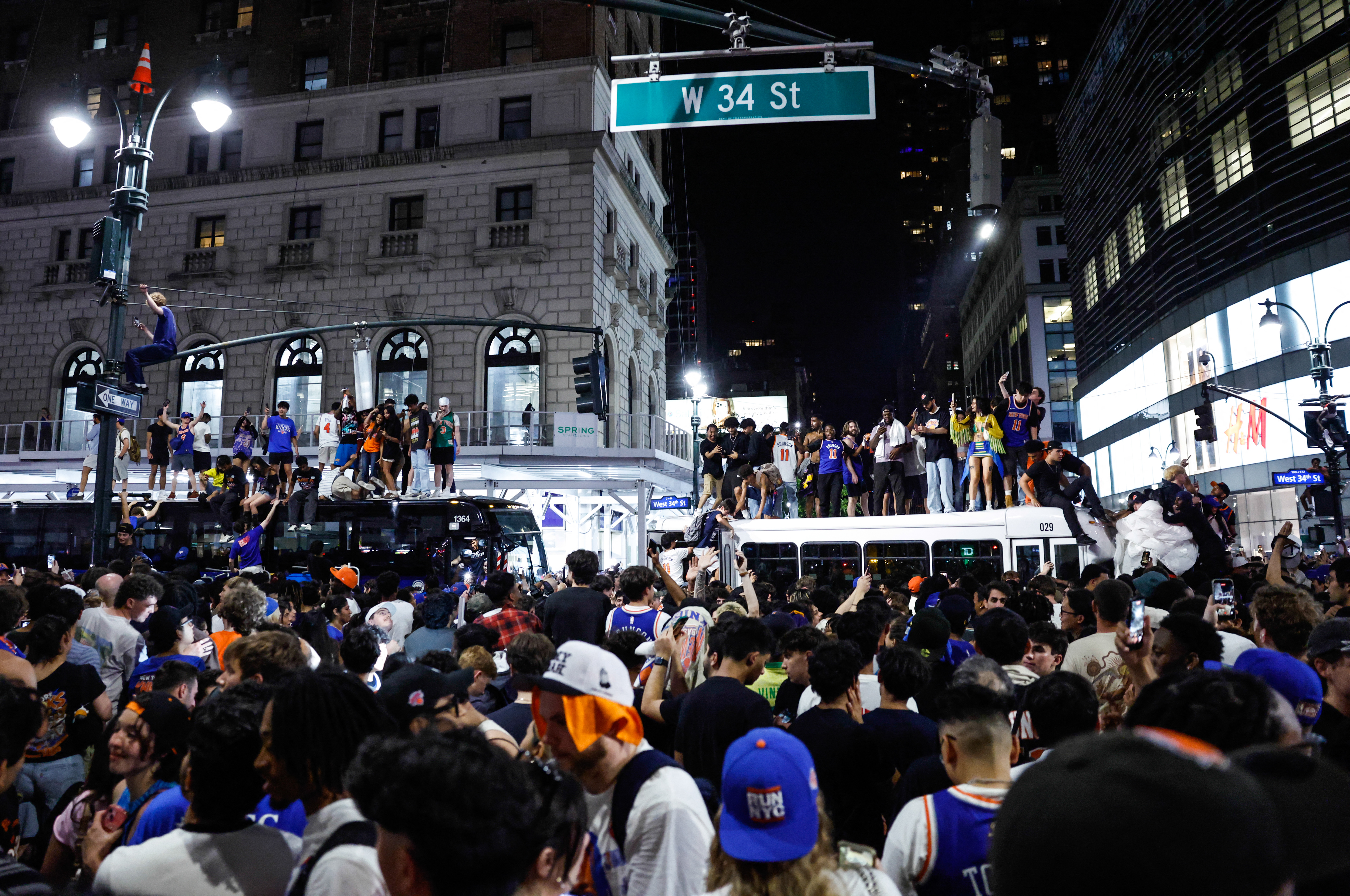 Source-feed image associated with An NYPD Officer Said I Could Climb A Street Sign After The Knicks Won The NBA Finals: ‘This Is Your Chance’
