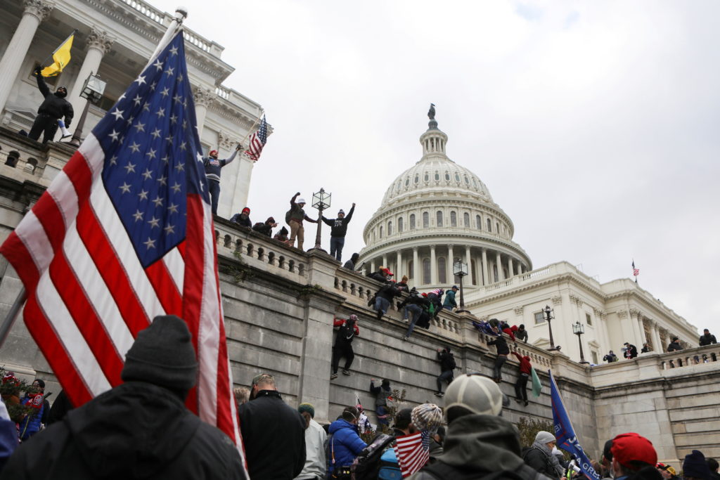Source-feed image associated with Trump administration's reframing of Jan. 6 reignites accountability debate