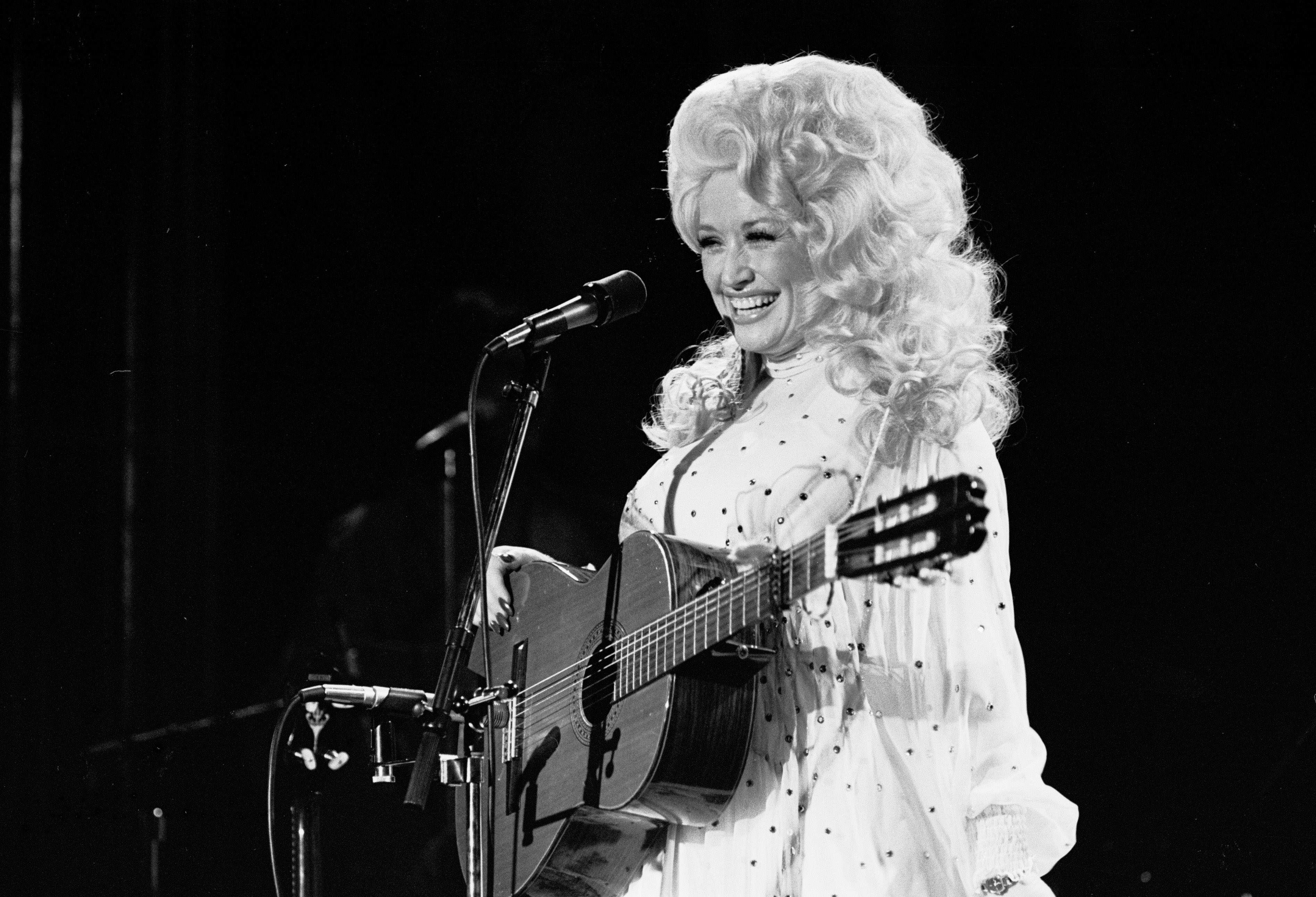 Source-feed image associated with Country Icon Dolly Parton Has Died at Age 80
