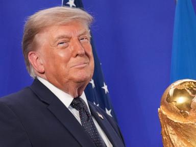 Source-feed image associated with Trump celebrates the World Cup as a US victory as he presents trophy to the winner, Spain