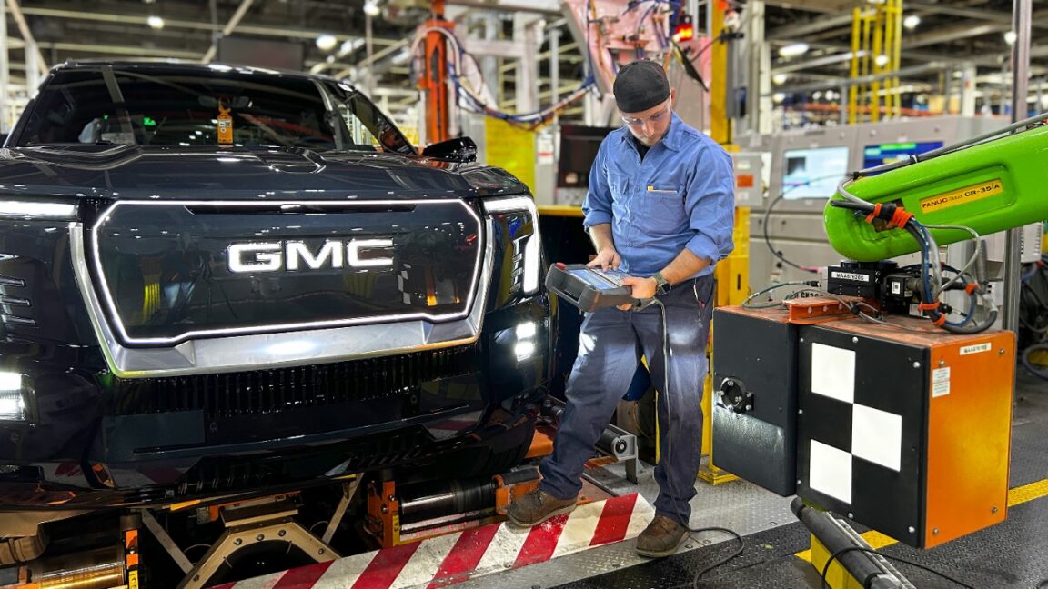 Source-feed image associated with GM installs robots at flagship EV factory after laying off 1,300 workers
