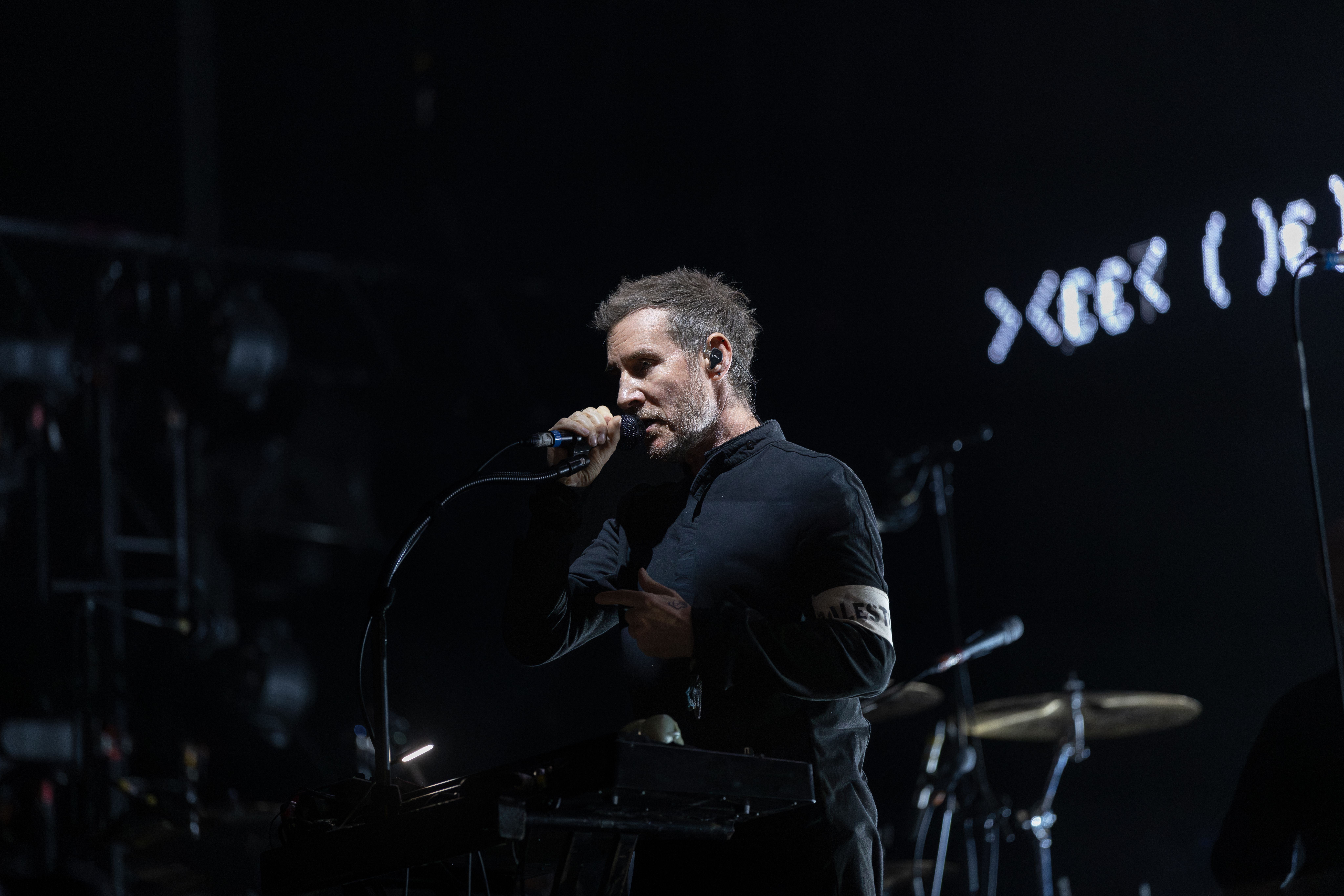 Source-feed image associated with Massive Attack Banned From Singapore After Displaying Palestine Flag Onstage