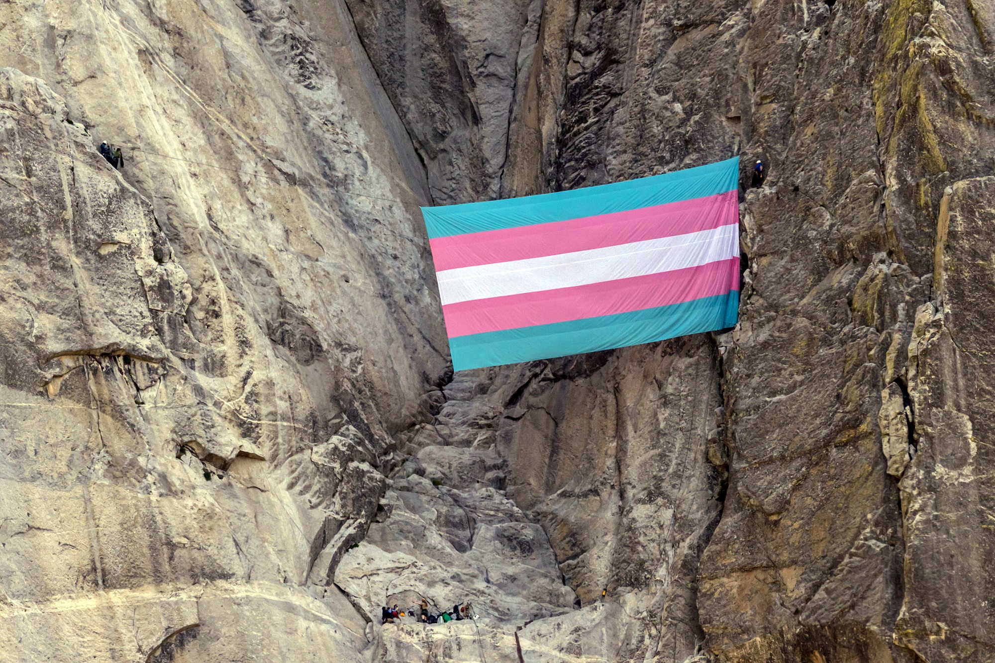 Source-feed image associated with Lawsuit Brought by Yosemite Ranger Fired After Hanging a Giant Transgender Flag Is Dismissed