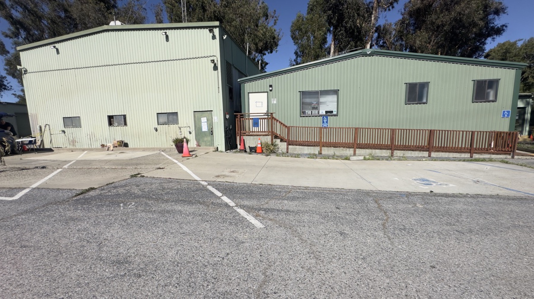 Facility buildings, ramp, and parking area at the Geng safe-parking site on May 13, 2026